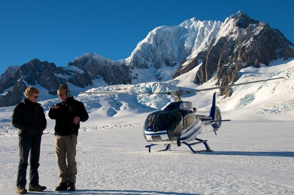 Minister of Conservation Kate Wilkinson talks to pilot Giles de Garnham of Glacier Helicopters during a snow landing on the Franz Josef Glacier on Sunday March 28